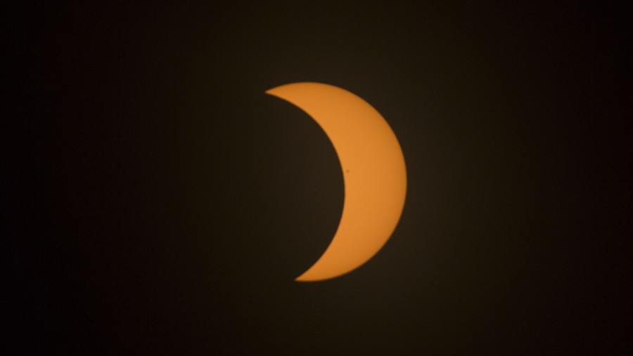 Ilustrasi gerhana matahari (Daniel Acker/Bloomberg)
