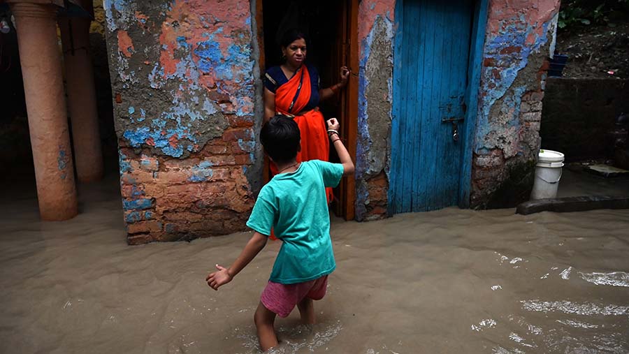 Ilustrasi Banjir. (Prakash Singh/Bloomberg)