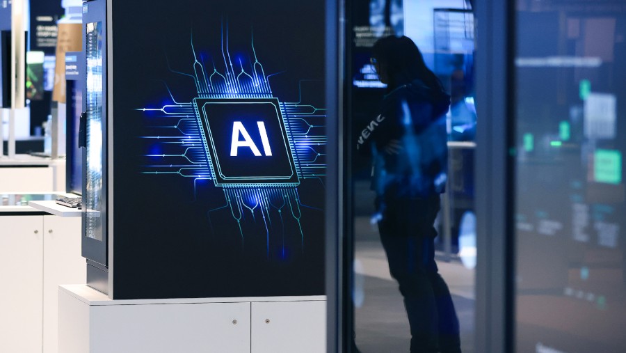 Booth dengan logo AI Siemens AG di Hannover, Jerman. dok: Krisztian Bocsi/Bloomberg