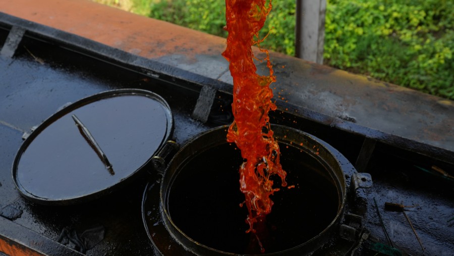 Palm oil poured into a truck. (Photographer: Dimas Ardian/Bloomberg)