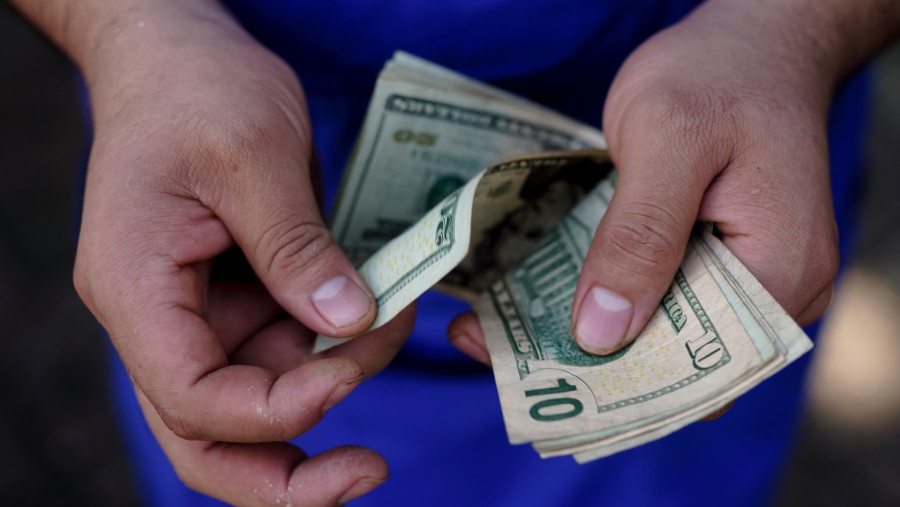 Menghitung dolar AS. dok: Bloomberg